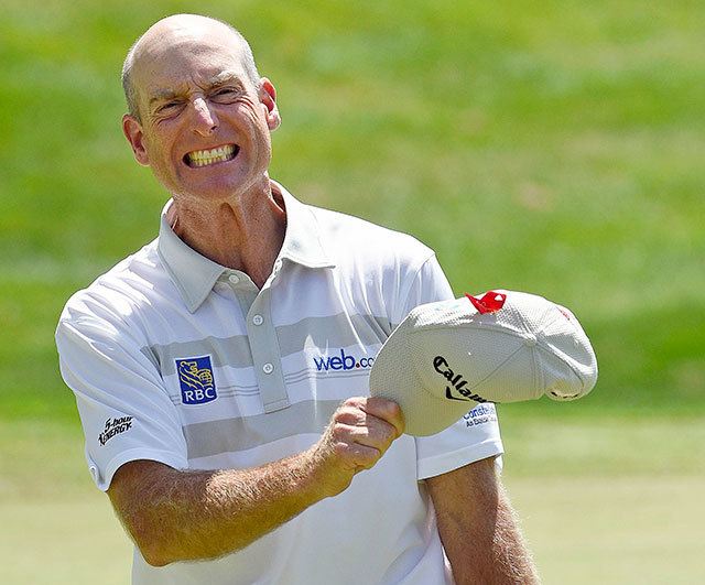 Jim Furyk celebrates after shooting a course and PGA Tour-record 58 during the final round of the Travelers Championship golf tournament in Cromwell, Conn., Sunday, Aug. 7, 2016. (AP Photo/Fred Beckham)