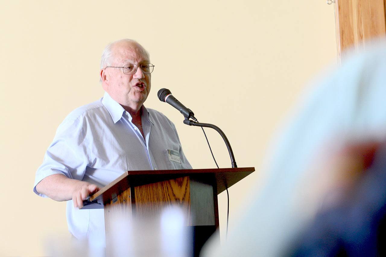 Americans need at minimum two weeks of guaranteed vacation days, John de Graaf, president of Take Back Your Time, an organization challenging overwork and time poverty in America, told guests at the Jefferson County Chamber of Commerce luncheon at Fort Worden in Port Townsend on Monday. (Jesse Major/Peninsula Daily News)