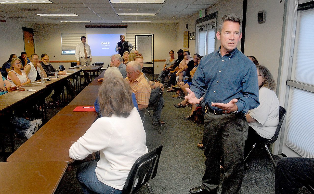 Port Angeles Police Chief Brian Smith, right, addresses public concerns about homelessness during a forum Wednesday at the Vern Burton Community Center. (Keith Thorpe/Peninsula Daily News)