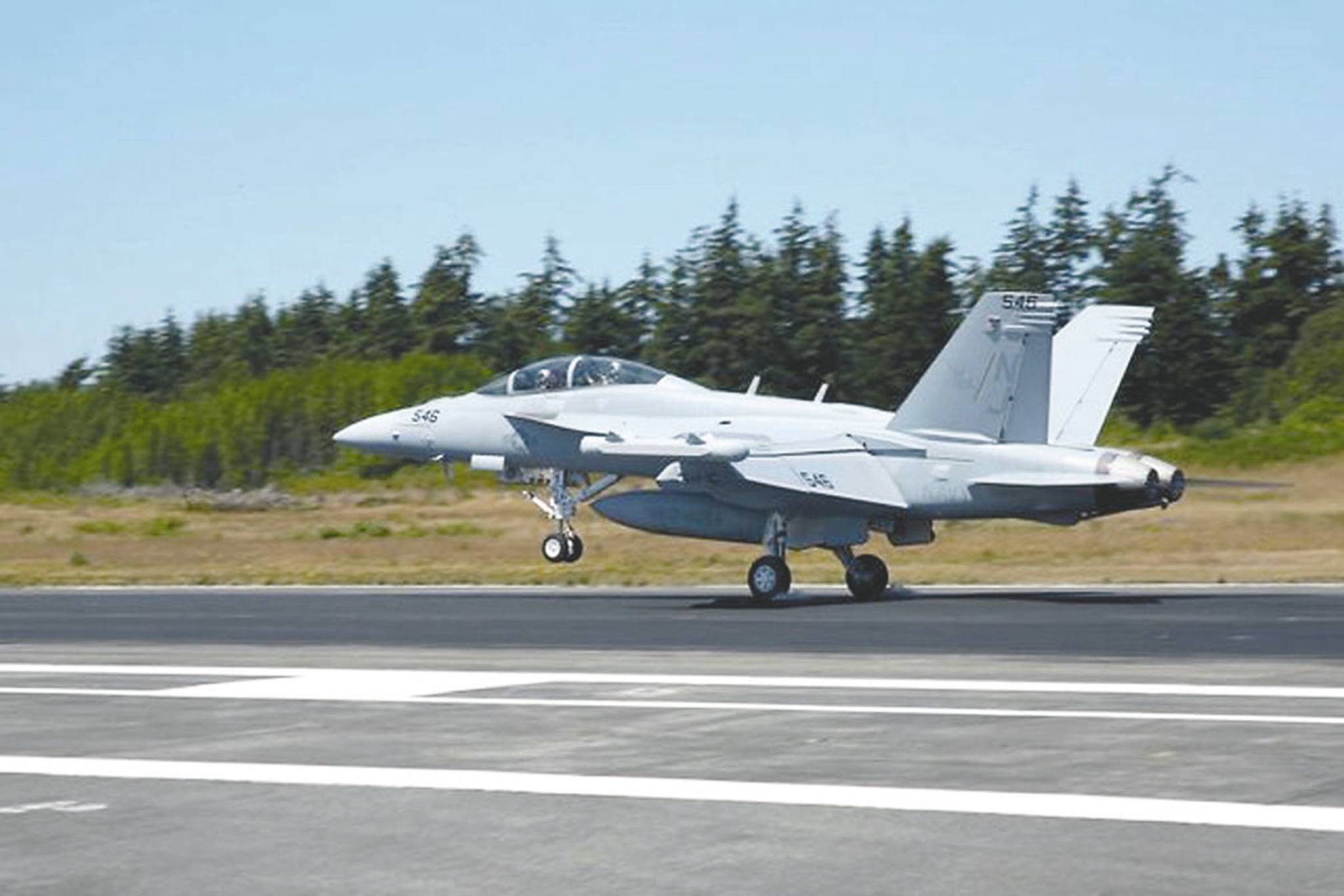 An EA-18G Growler assigned to Electronic Attack Squadron (VAQ) 129 lands on Naval Air Station Whidbey Island’s Ault Field. (U.S. Navy)