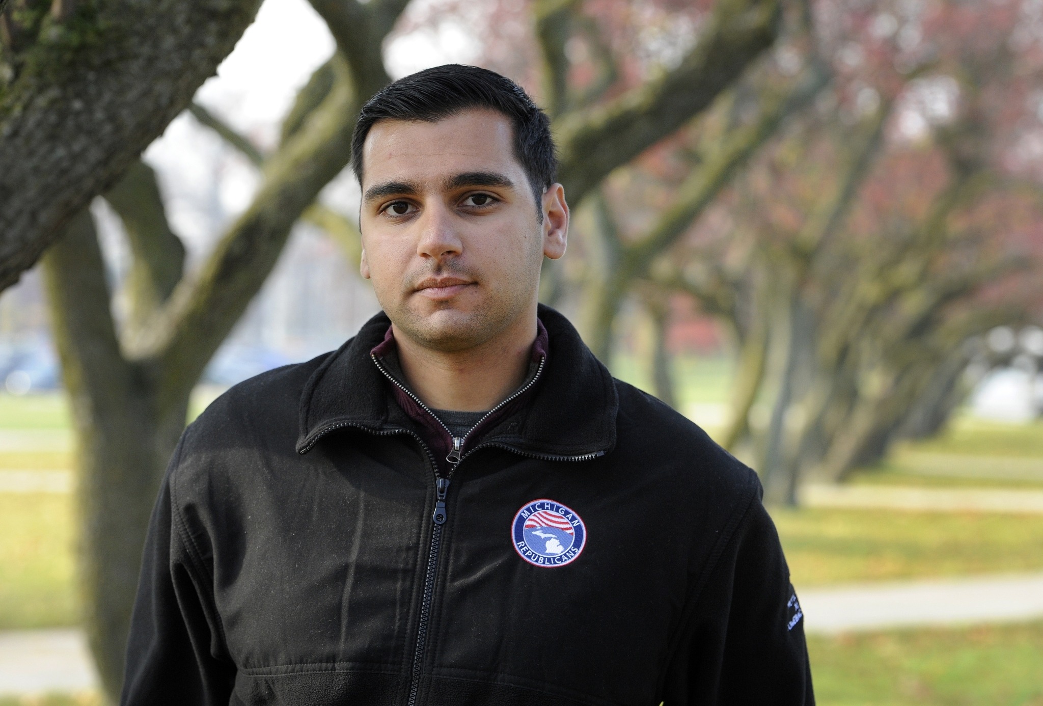 Oakland University senior Michael Banerian stands on campus in Rochester, Mich., on Thursday. Banerian, a Republican representative to the Electoral College, has been receiving death threats. (Jose Juarez/The Associated Press)