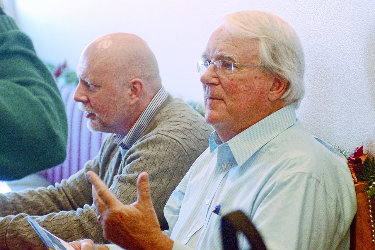 Brooke Taylor, chairman of the Port Angeles Waterfront Center, talks with Port Angeles Business Association members following his presentation Tuesday on the efforts to build a new performing arts center in Port Angeles. (Jesse Major/Peninsula Daily News)