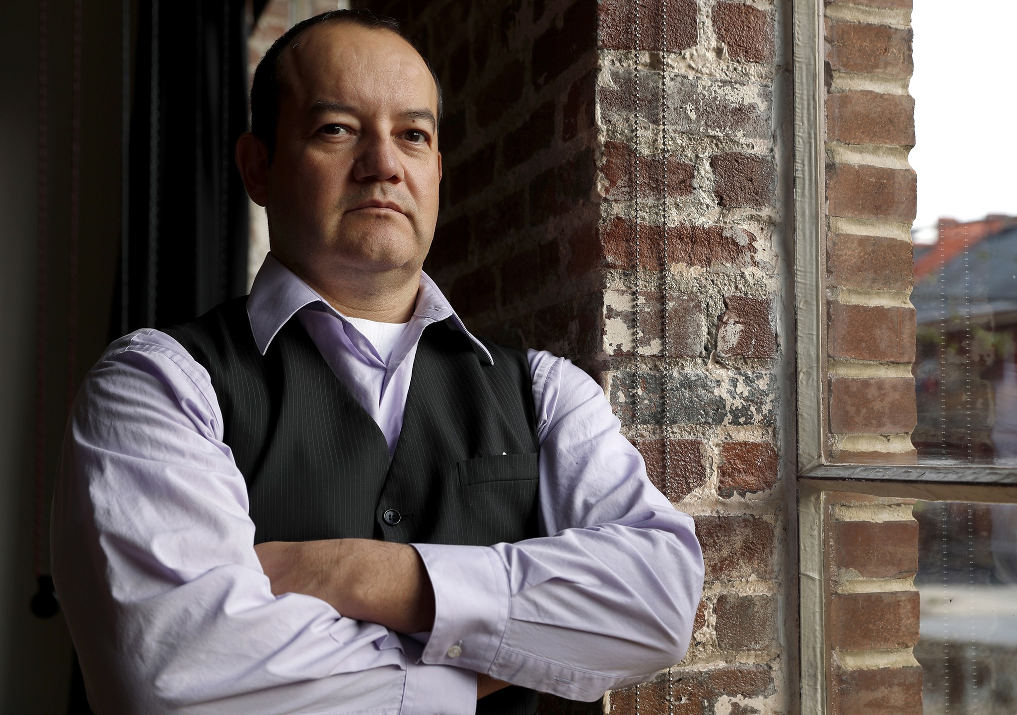 Hector Maldonado poses for a photo in St. Louis. Maldonado backed Ted Cruz in the primaries but will cast his vote for Trump with conviction. “I took an oath once to become a U.S. citizen,” he said, “and on Aug. 14, 1995, that was the first oath that I’ve taken to support the U.S. Constitution. A year later, I took the oath again, to support the duties of being an officer in the U.S. Army. This was the third oath that I’ve taken to execute what I promised to do.” (Jeff Roberson/The Associated Press)