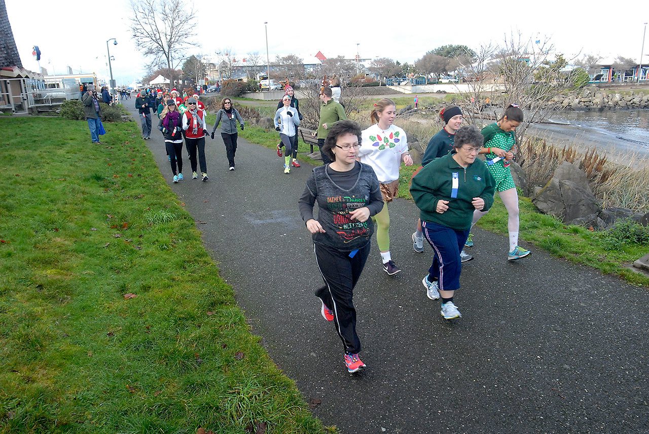 Runners take part in the Reindeer Fun Run along the Waterfront Trail in Port Angeles in December 2015. (Keith Thorpe/Peninsula Daily News)