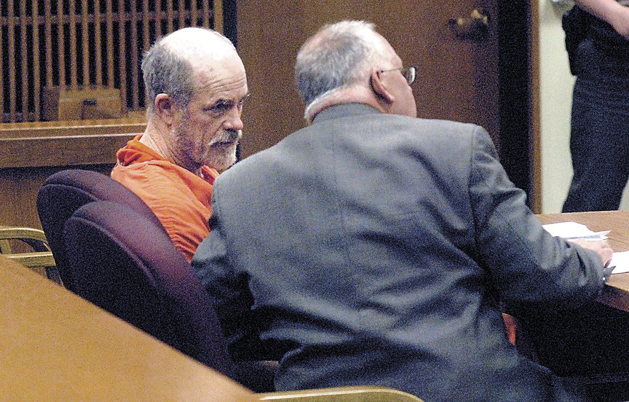 Riley E. White, left, consults with public defender Harry Gasnick during a status hearing in Clallam County Superior Court in Port Angeles in 2016. (Keith Thorpe/Peninsula Daily News)