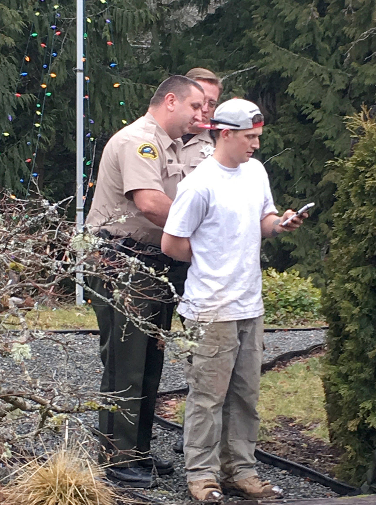 Ethan Anthony Wells, 22, was arrested on an active warrant for armed robbery and possession of child pornography, the Clallam County Sheriff’s Office said.
