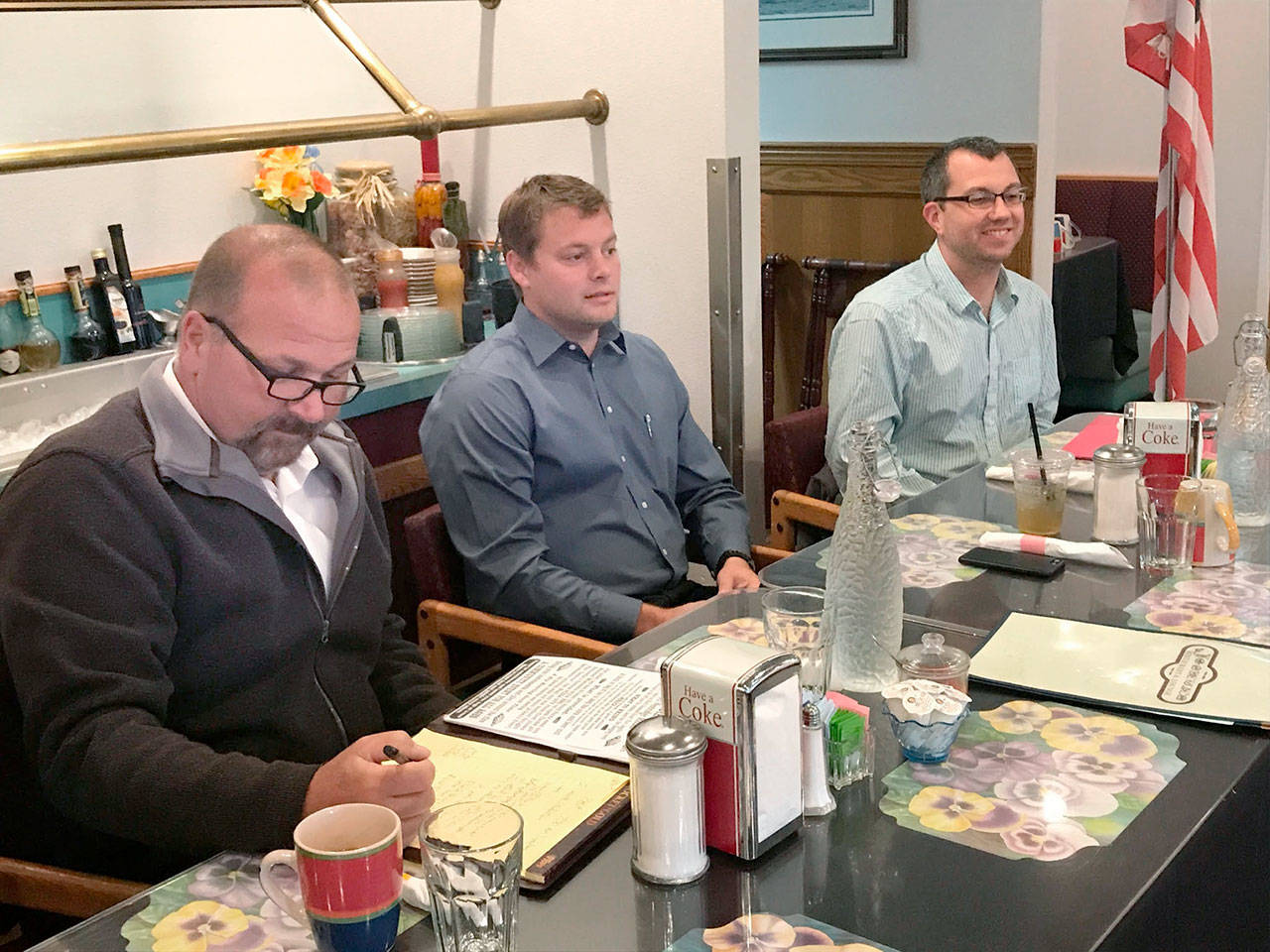 Port Angeles City Council candidates, from left, incumbent Lee Whetham and challengers Jacob Oppelt and Mike French, wait Tuesday for a primary election forum to begin. (Paul Gottlieb/Peninsula Daily News)