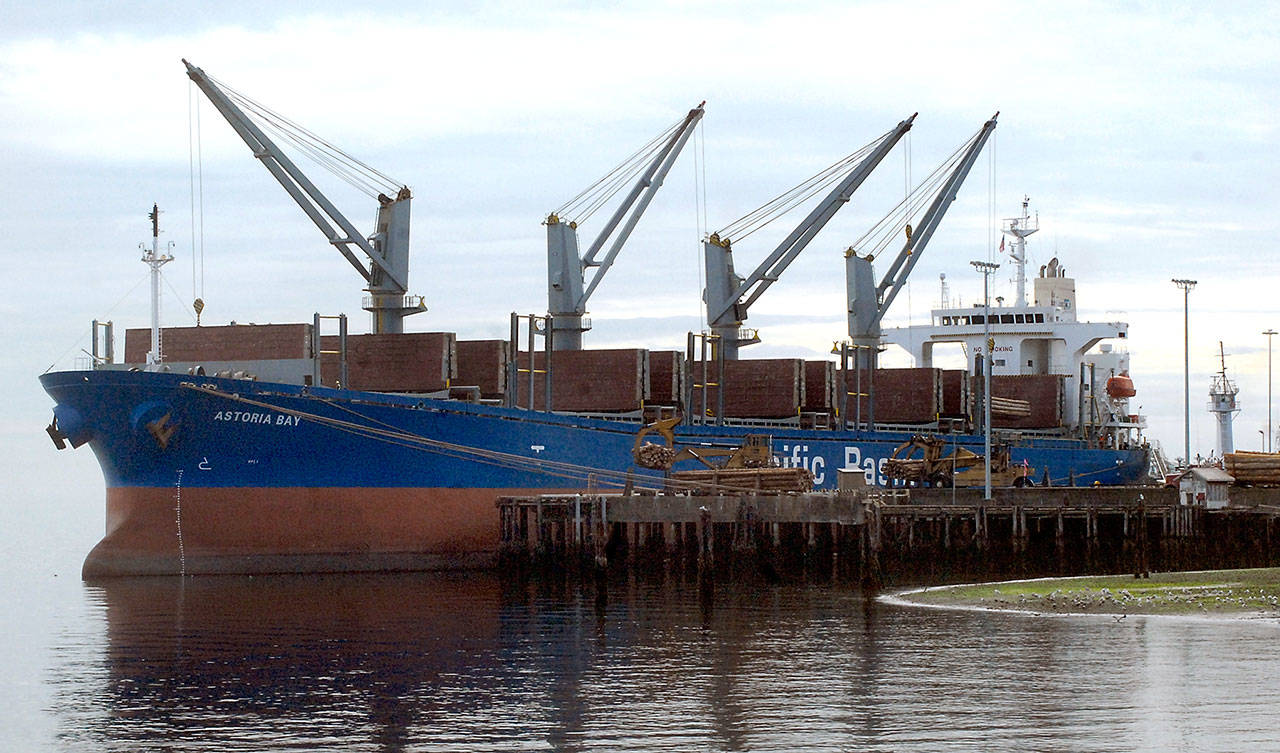 The cargo ship Astoria Bay takes on a load of logs at the Port of Port Angeles Terminal 3 in Port Angeles on Saturday. (Keith Thorpe/Peninsula Daily News)