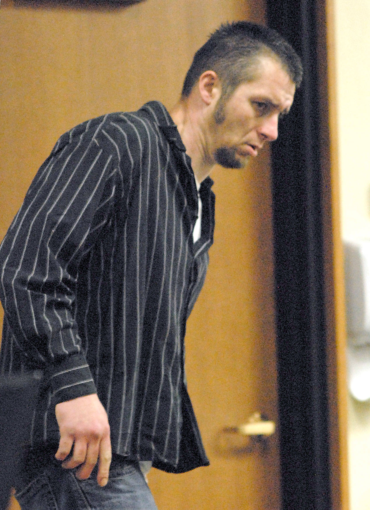 Dennis Jason Wayne Fisher enters Clallam County Superior Court on Thursday in Port Angeles. (Keith Thorpe/Peninsula Daily News)