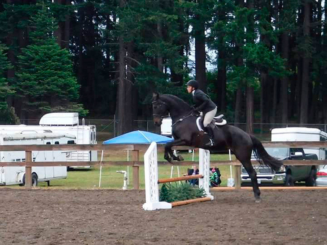 Blaire Flamand, 31, shows her jumping skills on Summer’s Eclipse at last year’s Star Spangled Horse Show at the Port Angeles fairgrounds. (Tom Ellis)