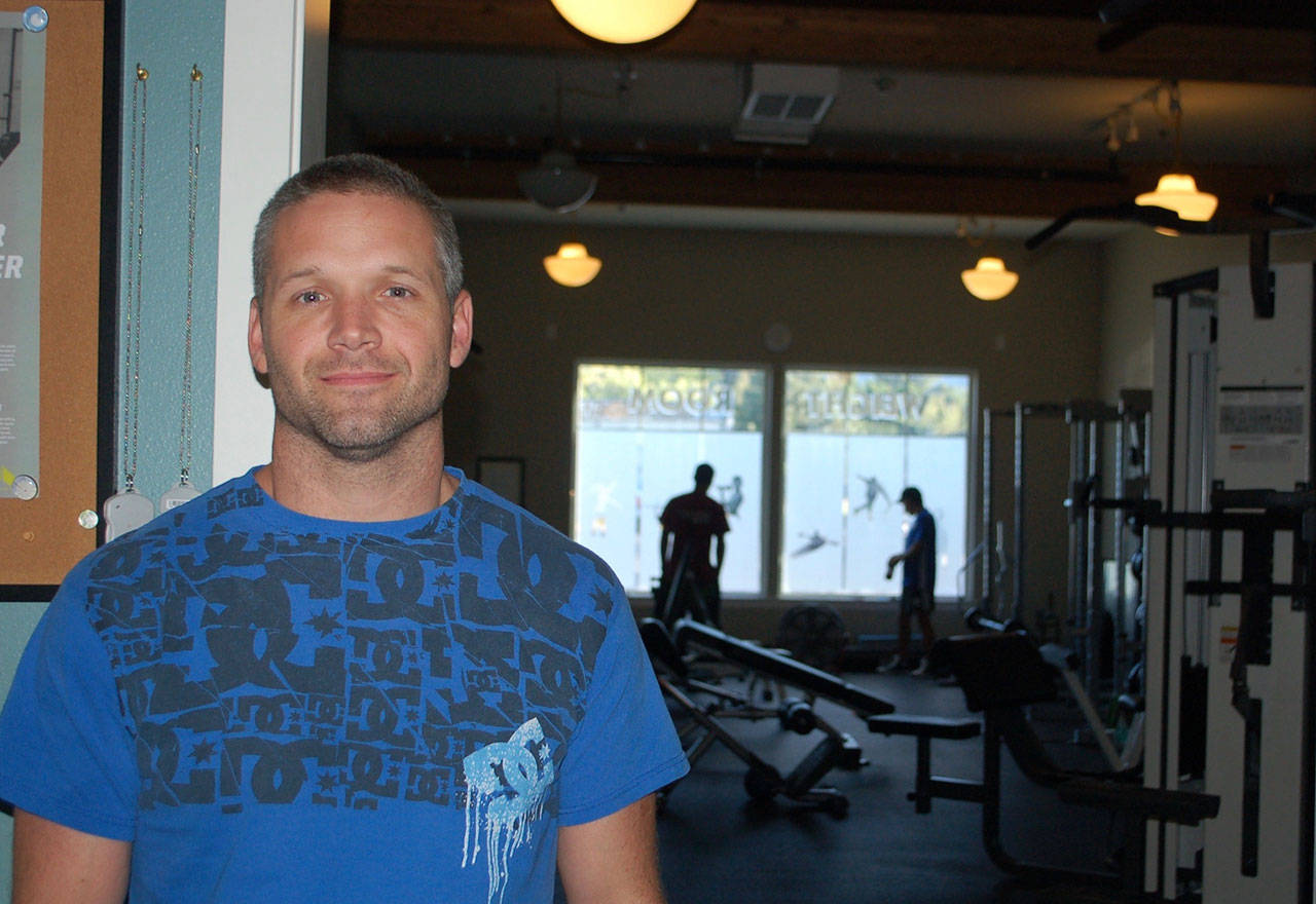 Kevin Pedrey, co-owner of Sequim Gym, stands in front of one of the gym facilities that will be closing with the rest of the business as of Sept. 1. (Erin Hawkins/Olympic Peninsula News Group)