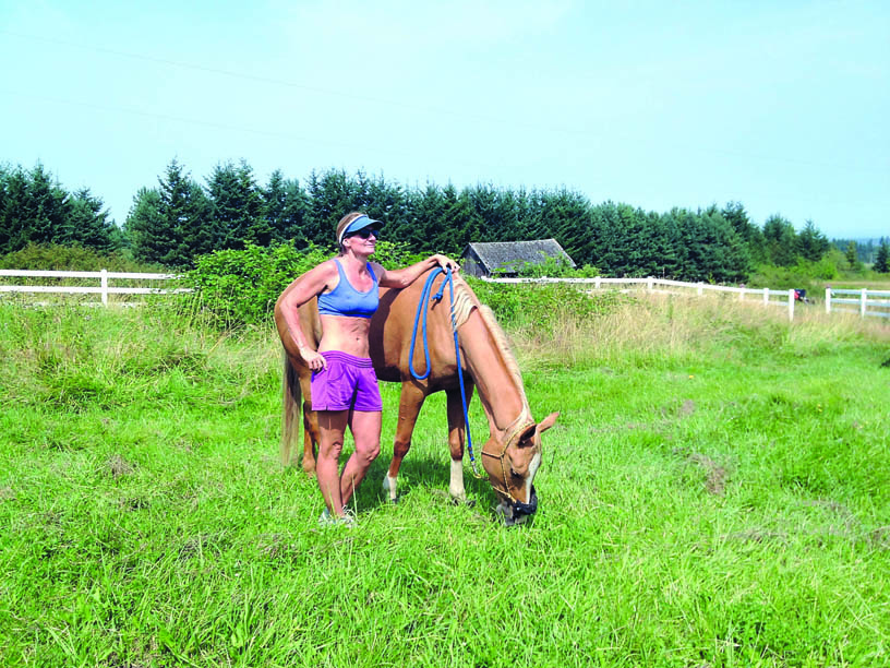 Lisa Preston pauses with her horse