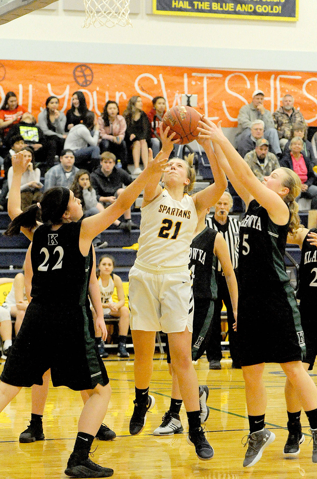 Forks’ Chole Leverington grabs a rebound in the Spartans’ 36-31 win over Klahowya Friday night. Leverington led the team with 16 points to help Forks go to 3-0 on the season. (Lonnie Archibald/for Peninsula Daily News)