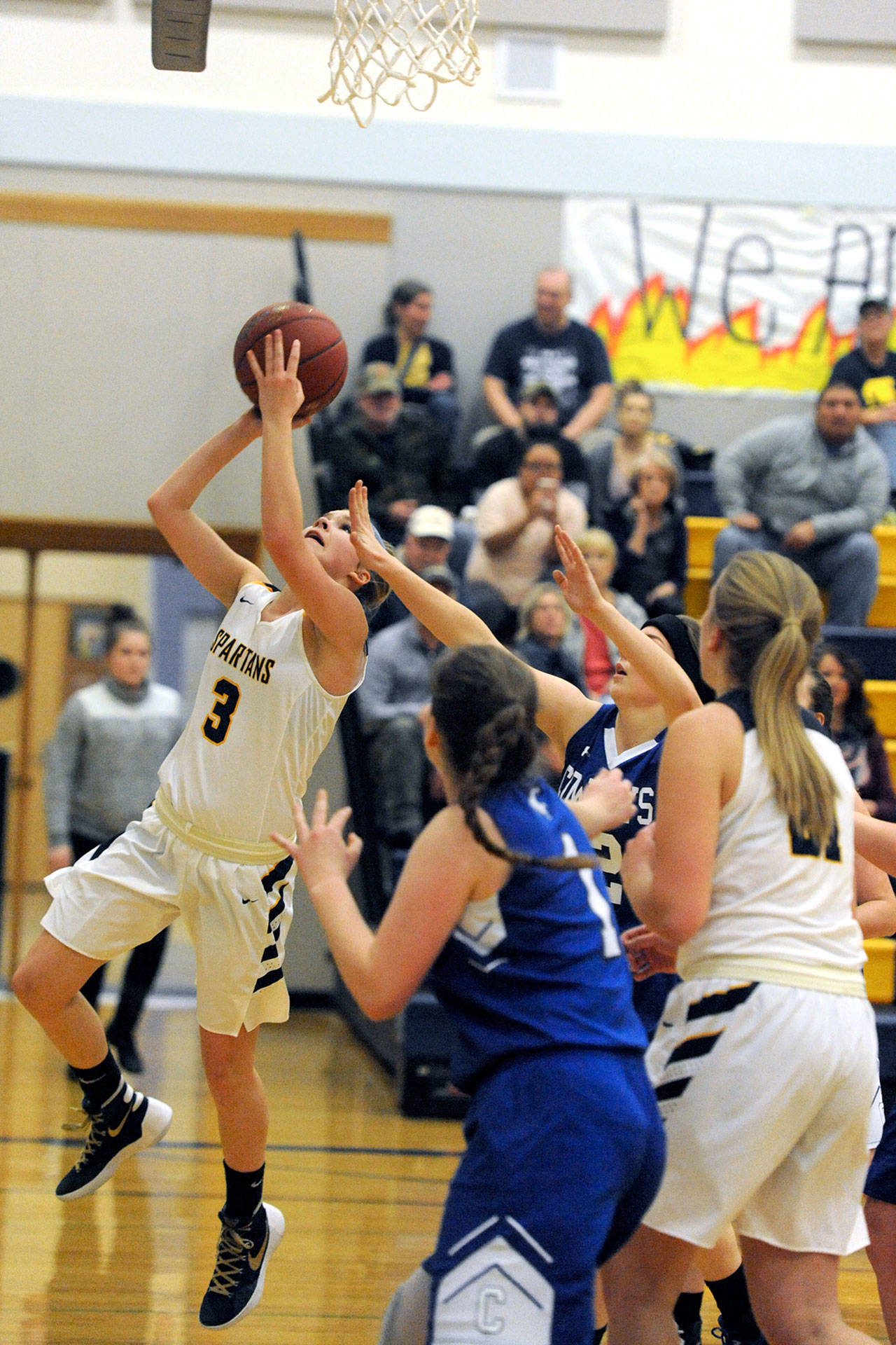Lonnie Archibald/for the Peninsula Daily News Forks’ Jayden Olson scores around the defense of Chimacum’s Clara Noble.