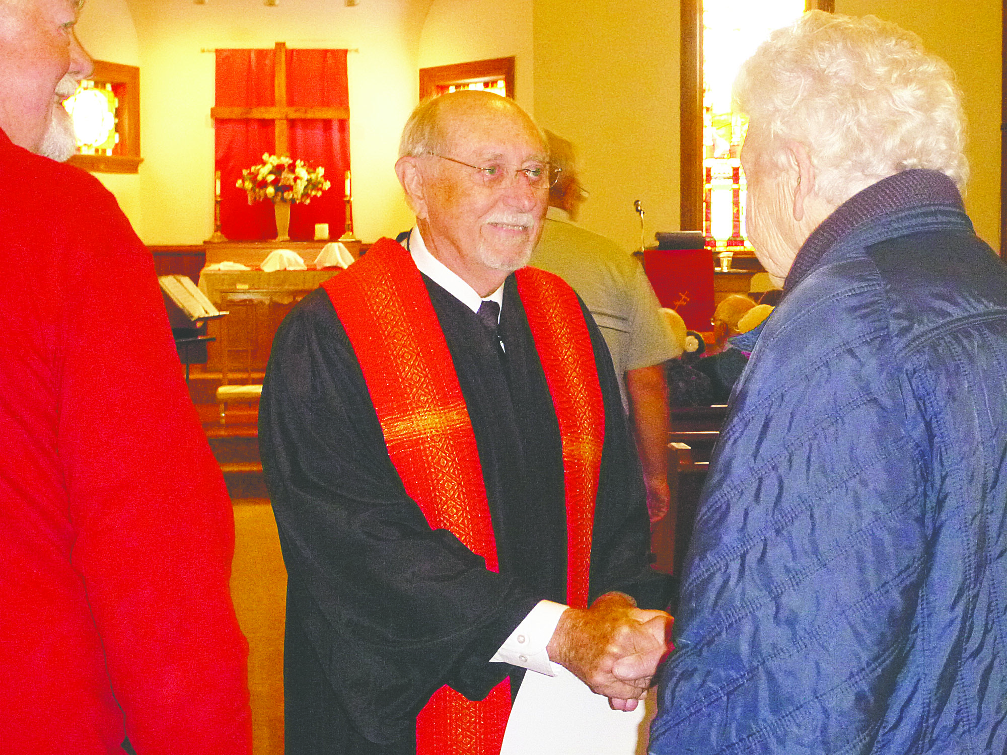 Pastor Wendell Ankeny greets Lois Haynes before the June 3 service