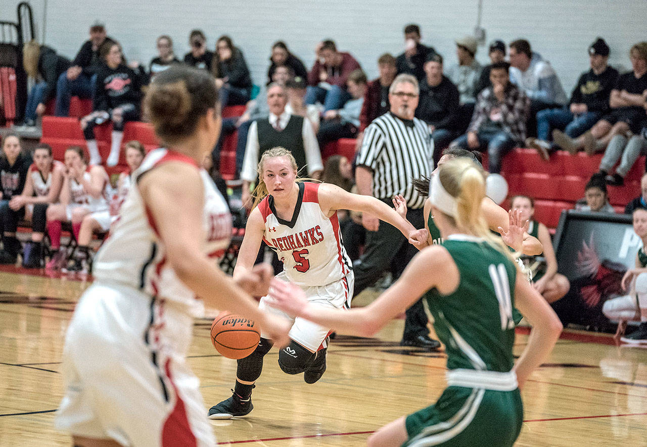 Port Townsend’s Kaitlyn Meek drives downcourt against Port Angeles Roughrider Gracie Long in a game played on Tuesday in Port Townsend.                                Steve Mullensky/for Peninsula Daily News
