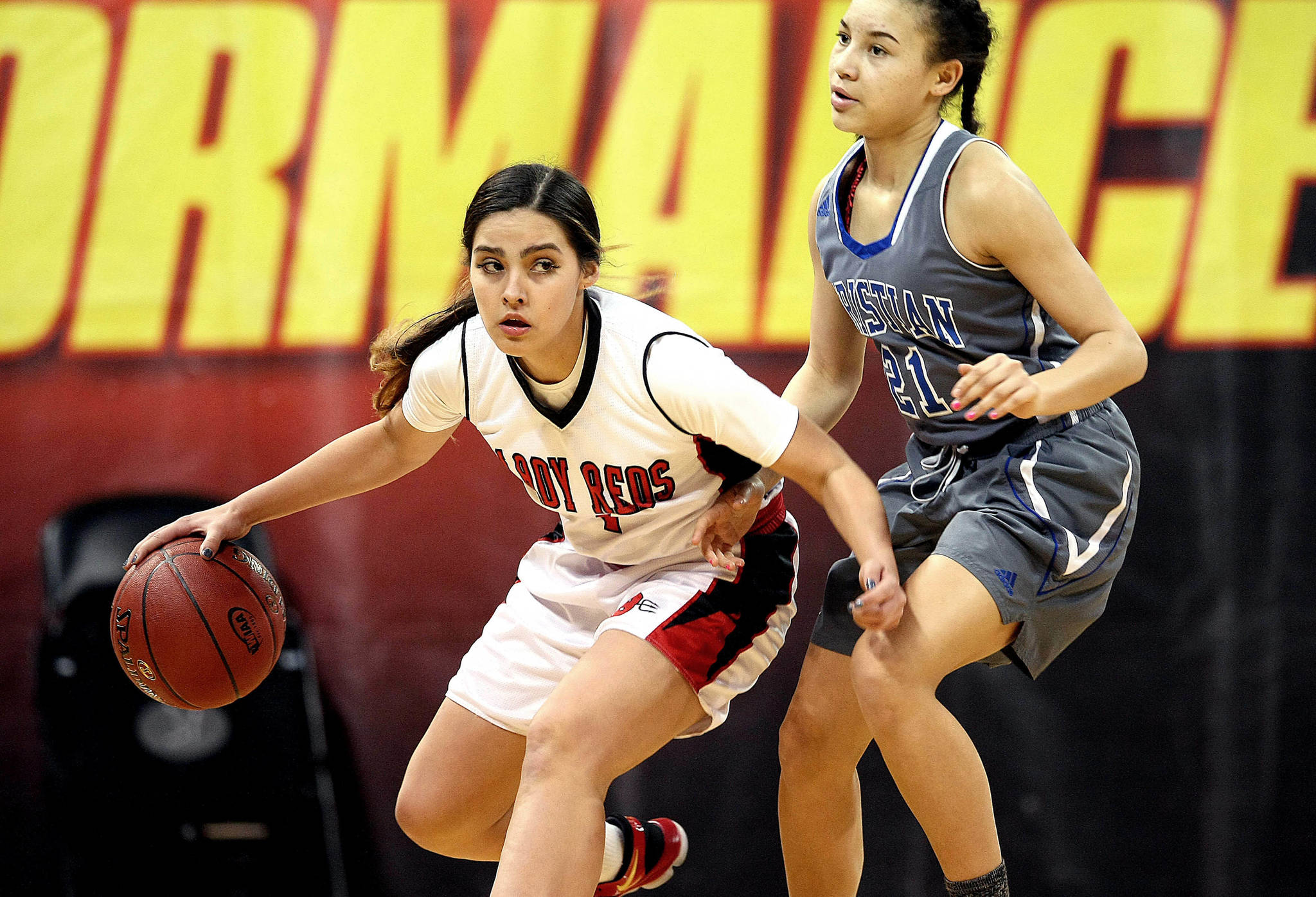 David Willoughby/for Peninsula Daily News                                Neah Bay’s Courtney Swan looks upcourt while defended by Mount Vernon Christian’s Jaiden Hill during the Red Devils’ 53-34 Class 1B state quarterfinal win over the Hurricanes at Spokane Arena on Thursday.