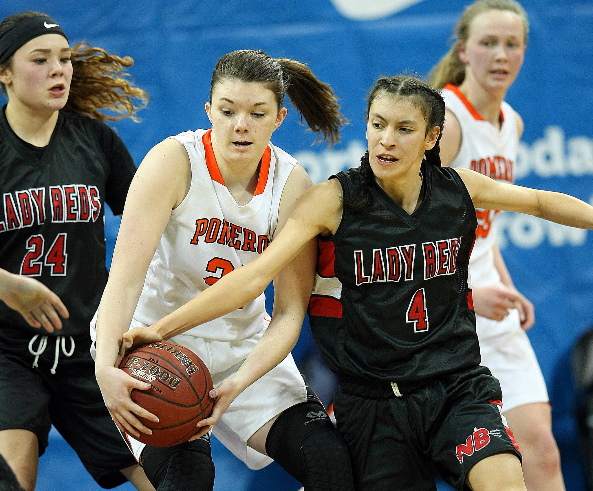 David Willoughby/for Peninsula Daily News Neah Bay’s Lalia Greene (4), tries to steal the ball from Pomeroy’s Sydney Smith during the Red Devils’ 44-29 Class 1B state semifinal loss Friday at Spokane Arena.