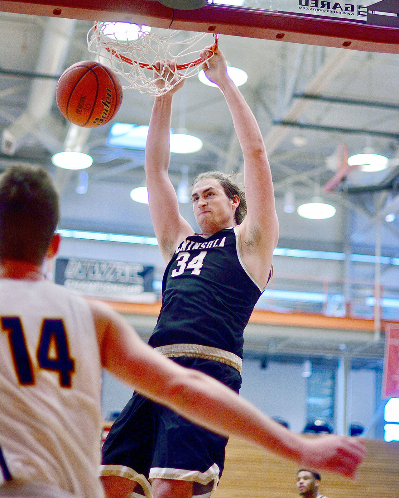 Peninsula’s Marky Adams dunks on Linn-Benton during the Pirates’ 89-75 win Saturday in the NWAC Tournament semifinals. Adams finished with 15 points. The Pirates play for the NWAC championship at 2:30 p.m. Sunday. (Jay Cline)