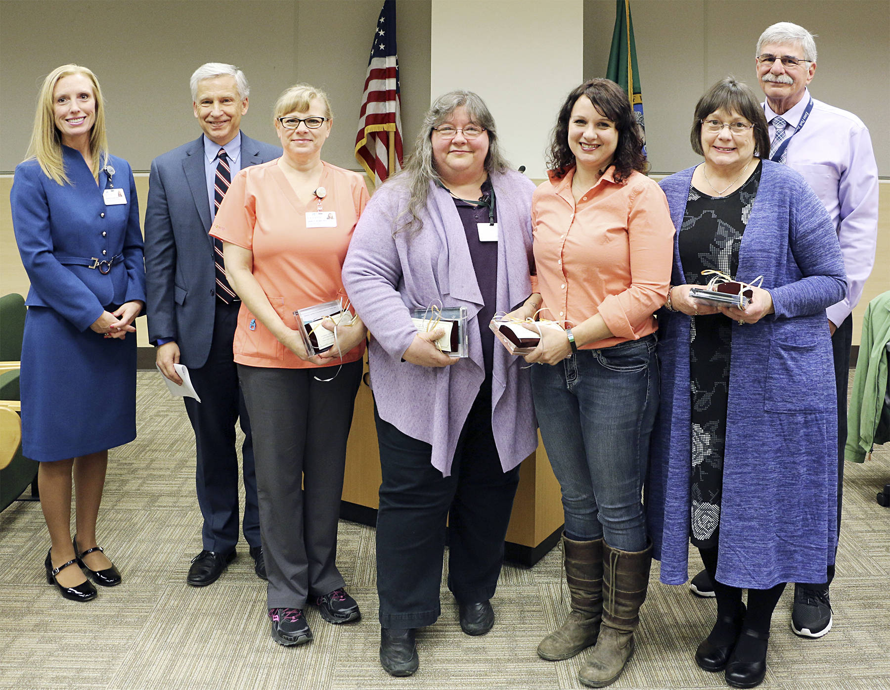 From left, Jennifer Burkhardt, chief human resources officer; Eric Lewis, CEO; Nancy Dahll; Patty Wood; Jena Hutton, RN; Laurie Elmer, RN; and Tom Oblak, hospital commissioner.