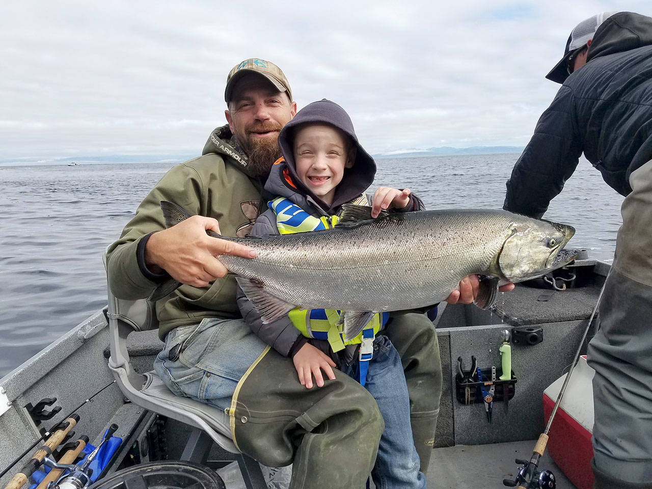 Pete Rosko Six-year old Bruce Thomson caught this hatchery chinook with his dad Eric on a 1 1/2 ounce all-glow Kandlefish jig.