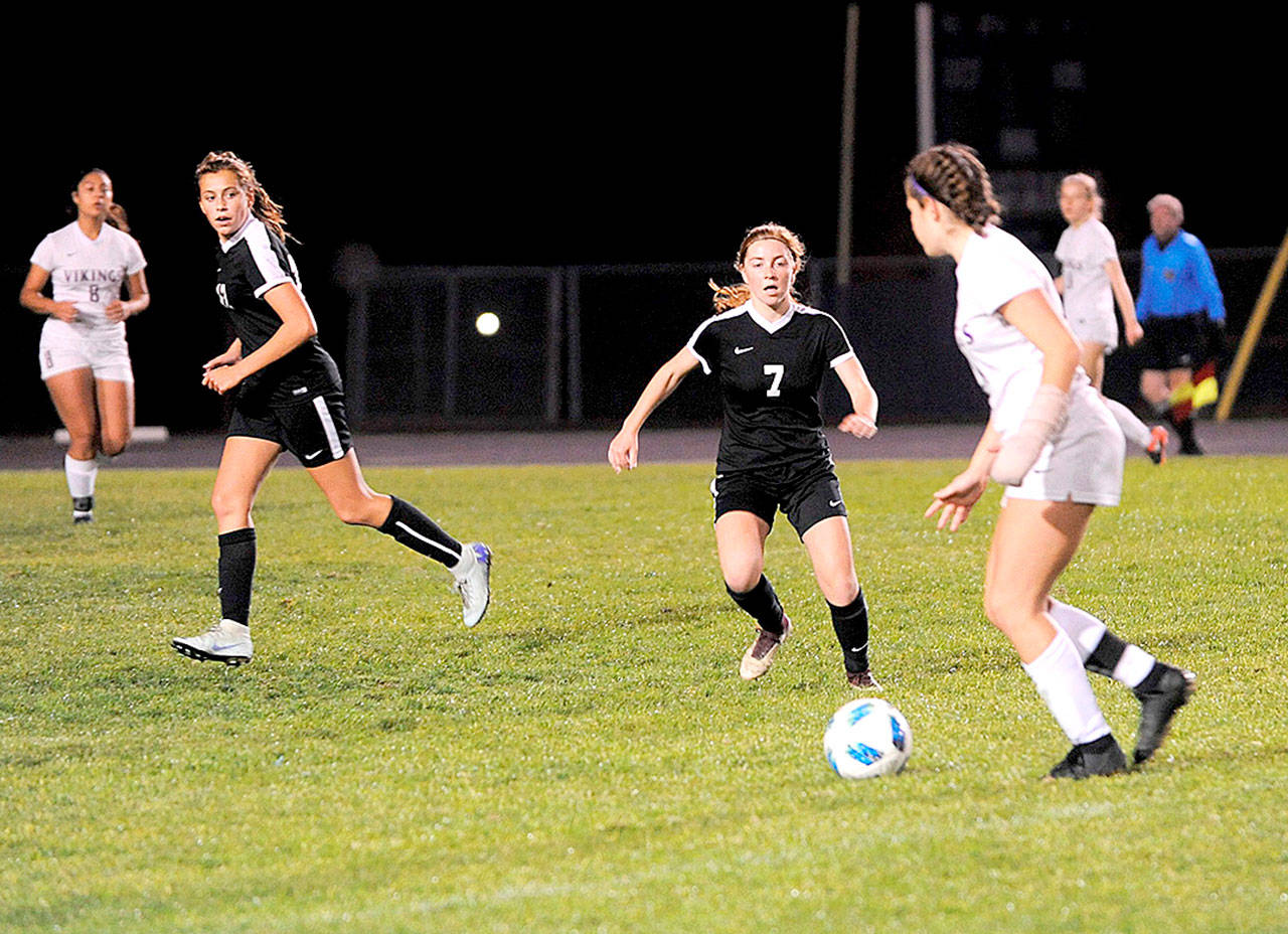 Sequim’s Daisy Ryan moves in on a North Kitsap player in the Wolves 1-0 win over the Vikings. Ryan had the game-winning goal in the 68th minute. (Matthew Nash/Olympic Peninsula News Group)