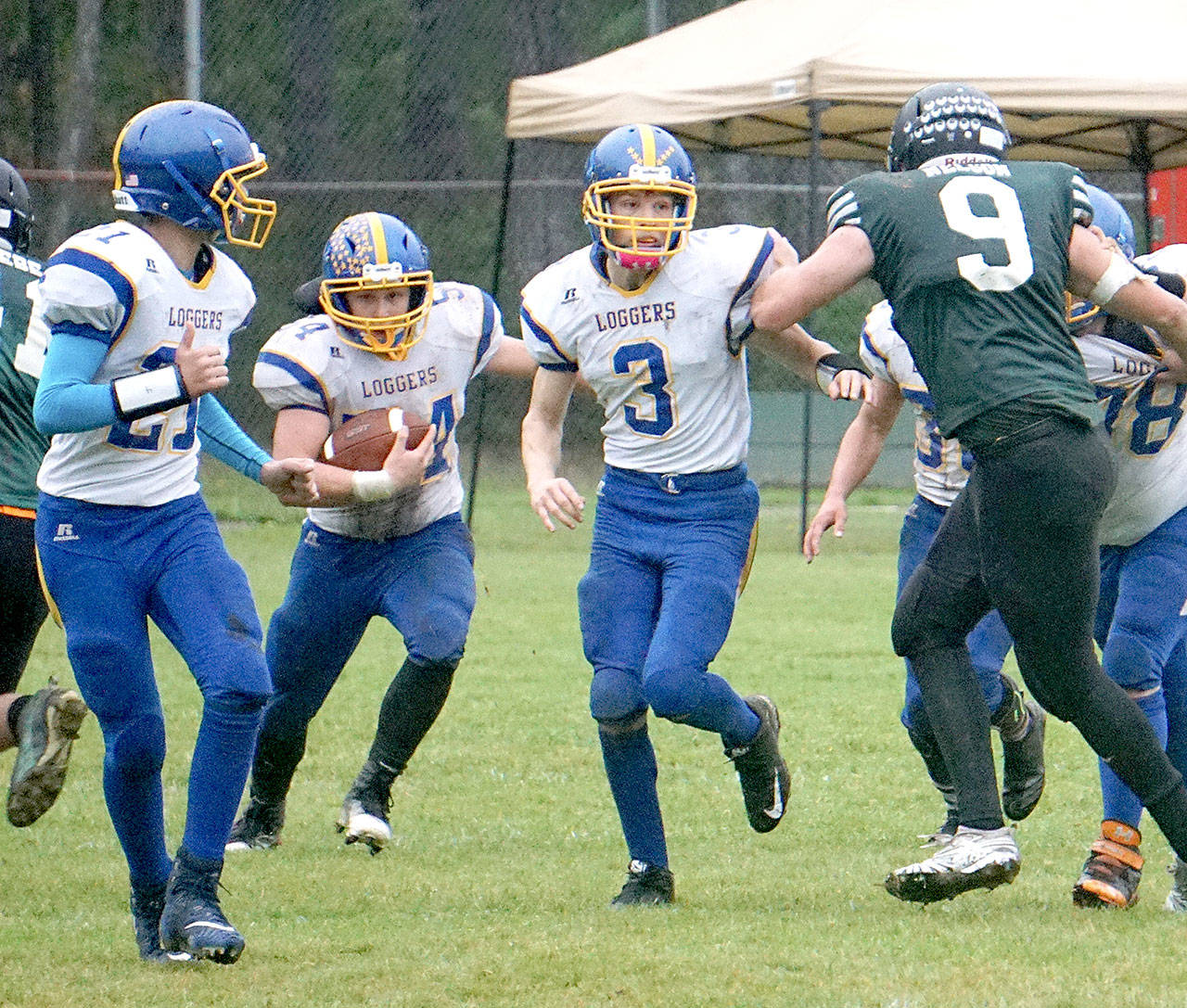 Crescent’s Noah Leonard (54) carries the ball Saturday with teammates Malachi Treadway (3) and Landen Buchanan blocking. Leonard rushed for 392 yards and scored 10 touchdowns in Saturday’s 86-28 win over Mary M. Knight.