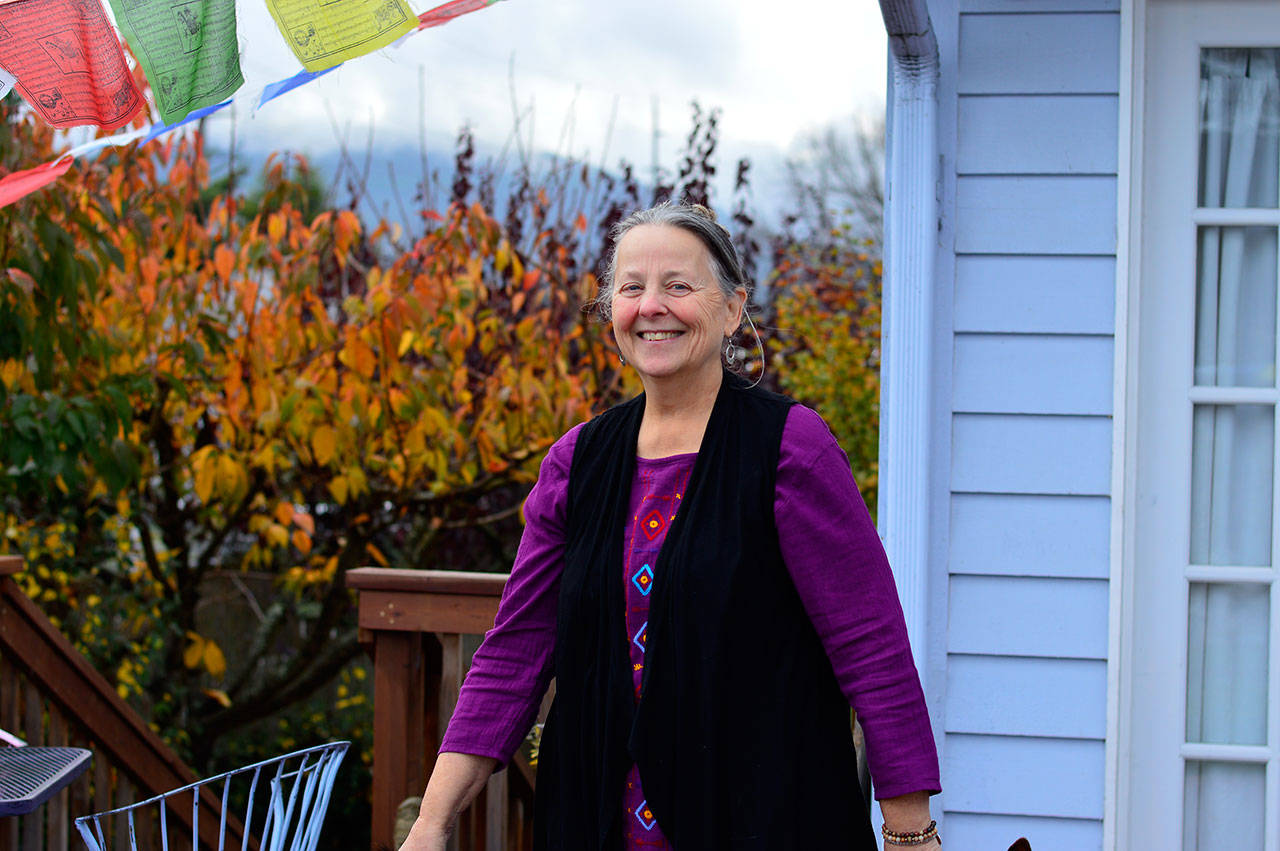 Kate McDermott revels in her “queendom”: her Port Angeles backyard. (Diane Urbani de la Paz/for Peninsula Daily News)