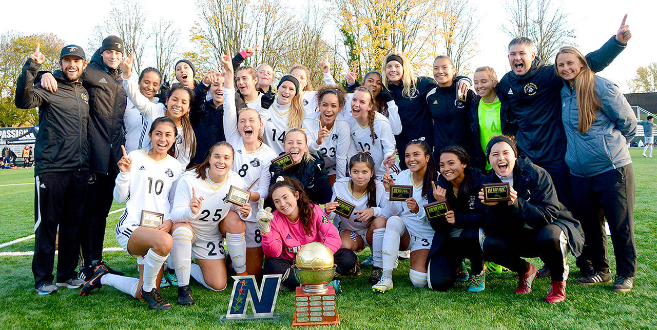 Jay Cline The Peninsula women’s soccer team celebrates its fourth NWAC championship at the Starfire Soccer Complex in Tukwila on Sunday.