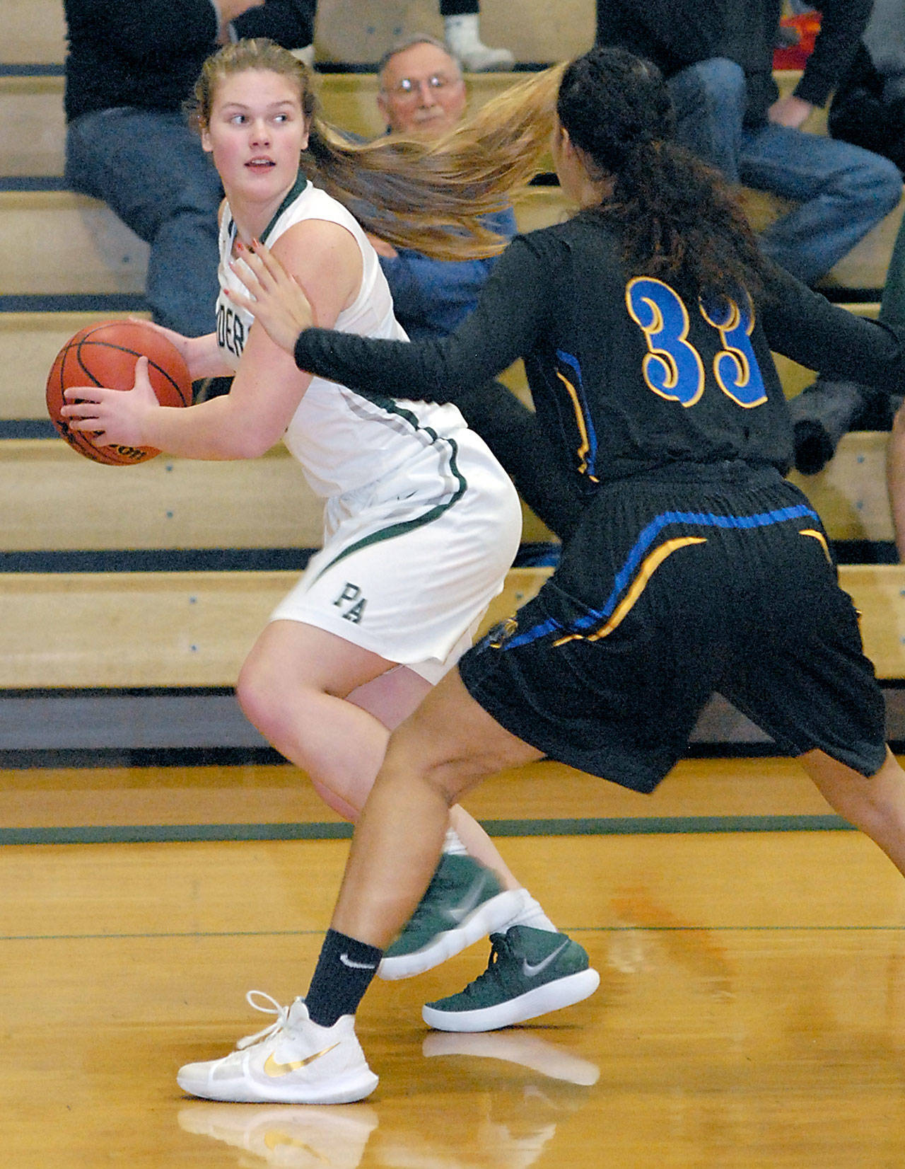 Keith Thorpe/Peninsula Daily News Port Angeles’ Myra Walker, left, looks to pass around the defense of Hazen’s Sharaya Coe during Saturday’s game at Port Angeles High School.