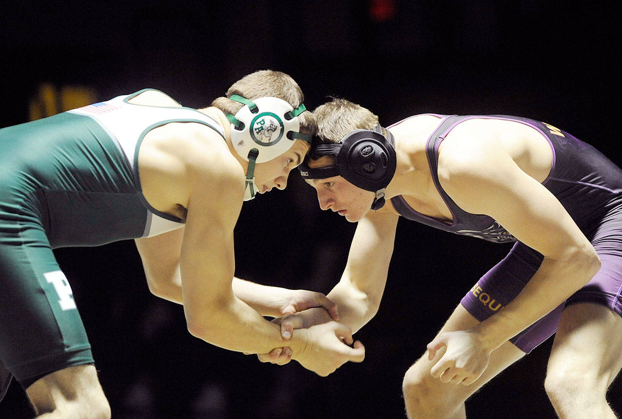 Michael Dashiell/Olympic Peninsula News Group Port Angeles’ Riley Gale, left, and Murray Bingham square off during their 170-pound match on Thursday. Gale earned a 1-0 win by decision over Bingham.