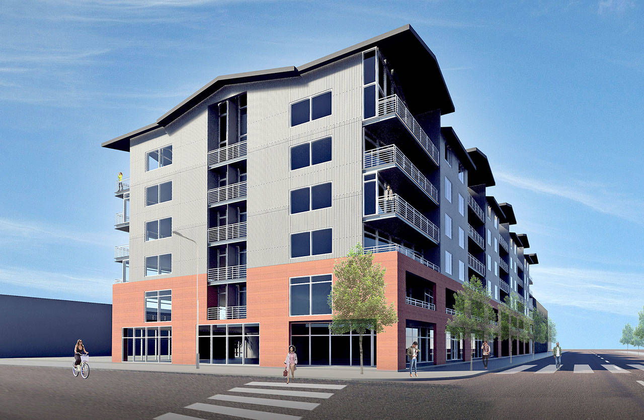 An architectural rendering shows a building including a parking garage, retail stores and condominiums proposed for 222 W. Front St. in Port Angeles. (MG2 Architects)