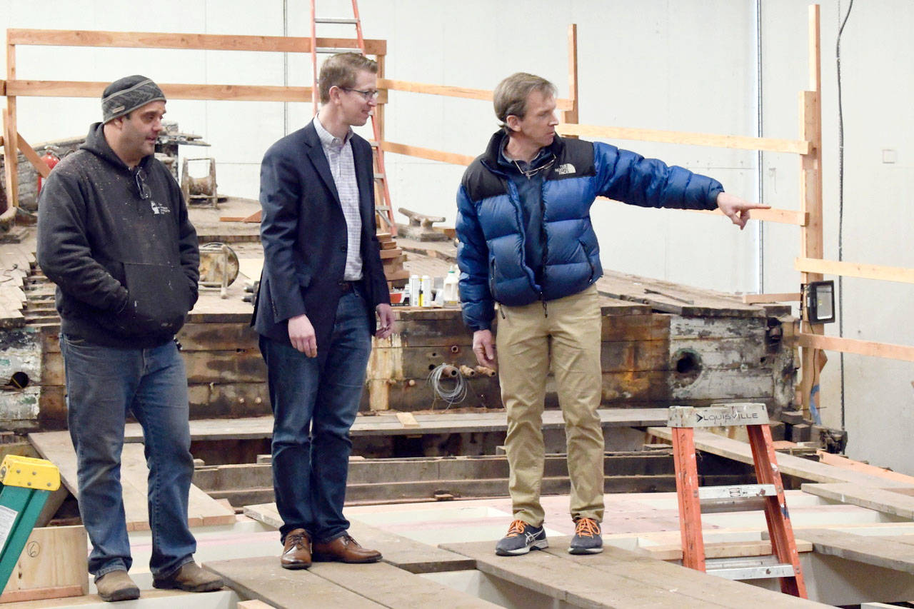 U.S. Rep. Derek Kilmer, D-Gig Harbor, talked with Chris Sanok of the Port Townsend Shipwrights Co-op and shipwright Tim Lee, left, at the Port Townsend Boat Haven. Kilmer was in Port Townsend to discuss the Maritime Washington National Heritage Area Act. (Jeannie McMacken/ Peninsula Daily News)
