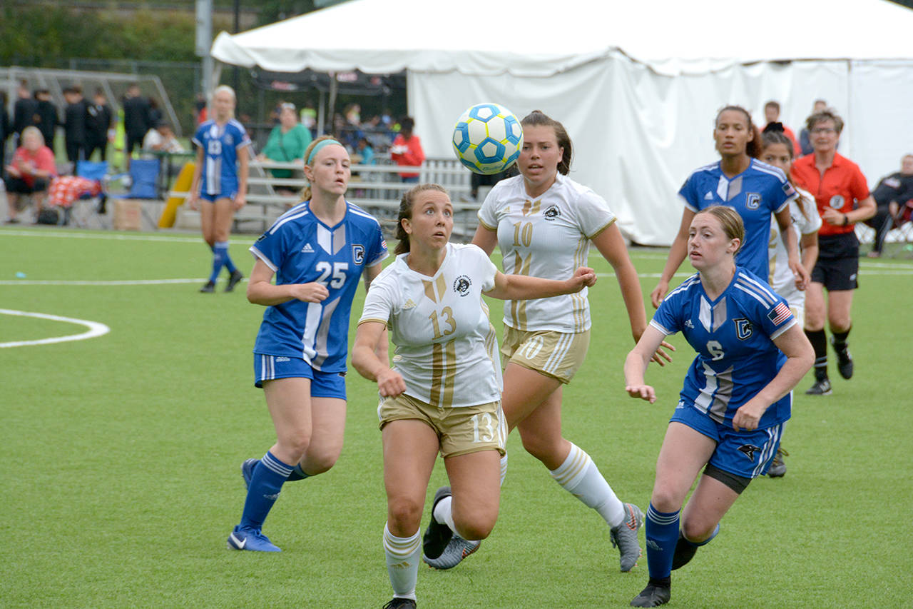 Courtesy Peninsula College Peninsula’s Grace Hipke, front, eyes the ball, while the Pirates’ Grace Johnson, looks on during a 3-1 win over Clark on Thursday.