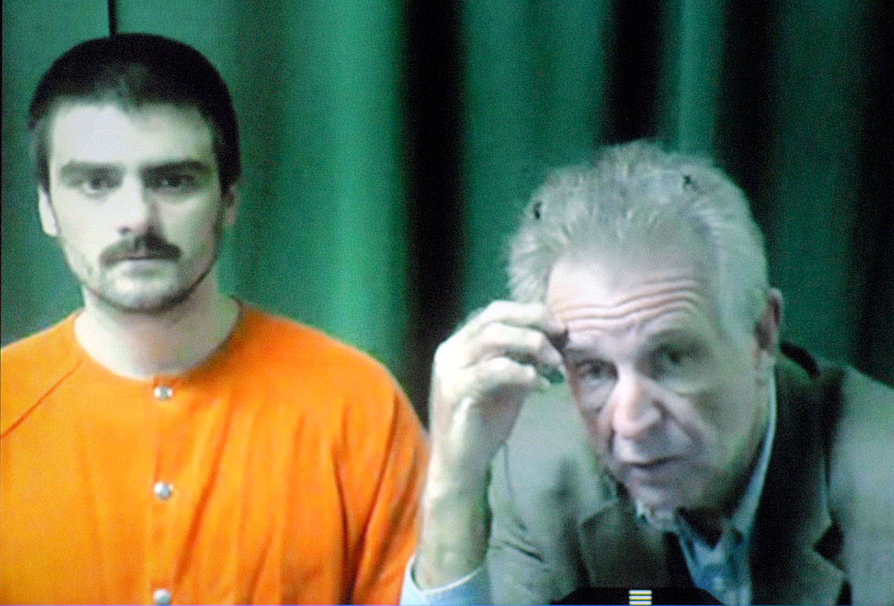Shay C. Darrow, left, appears with attorney John Hayden by video link for a status hearing in Clallam County Superior Court on Friday. (Keith Thorpe/Peninsula Daily News)