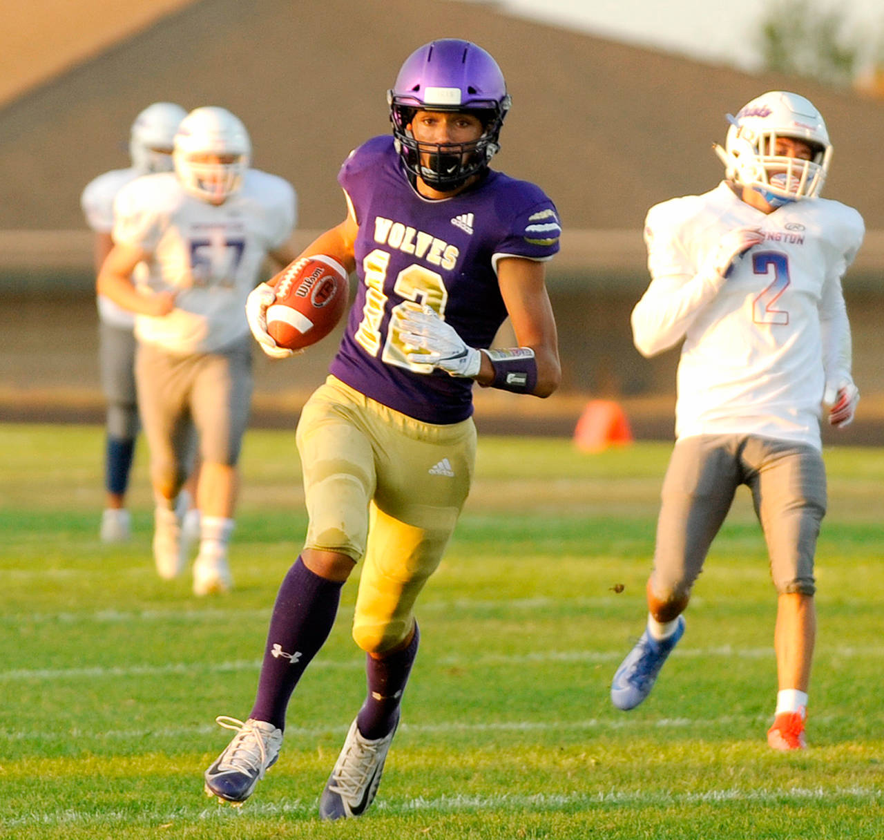Michael Dashiell/Olympic Peninsula News Group Sequim wide receiver Hayden Eaton scored on this 45-yard pass from Taig Wiker in the Wolves’ 42-14 win over Washington.