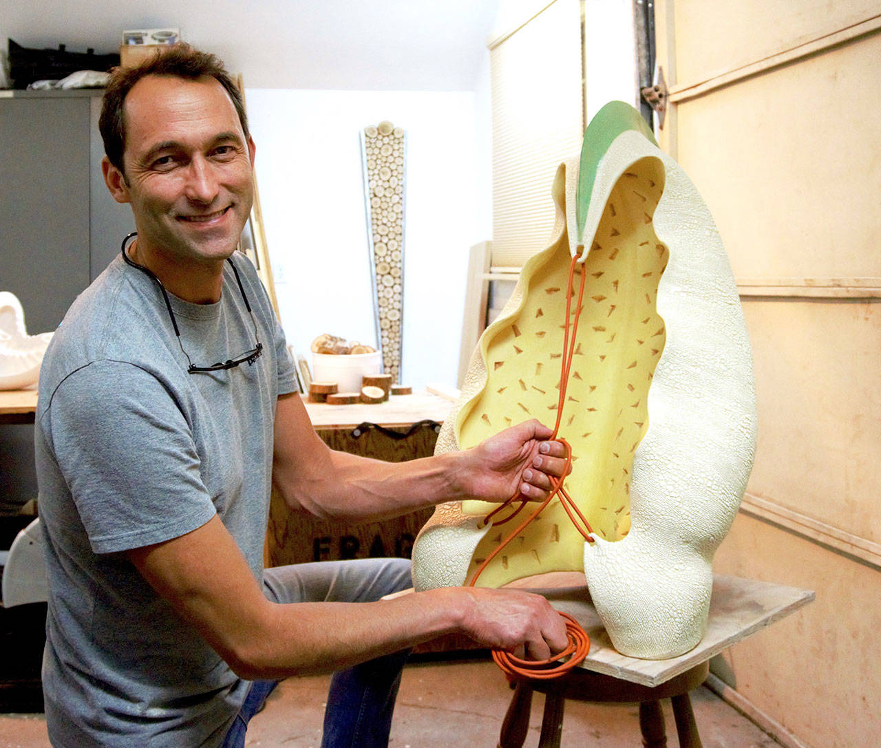 Sculptor Steve Belz works in his Port Angeles studio. His show, “Taking It In,” opens Saturday at the Port Angeles Fine Arts Center.