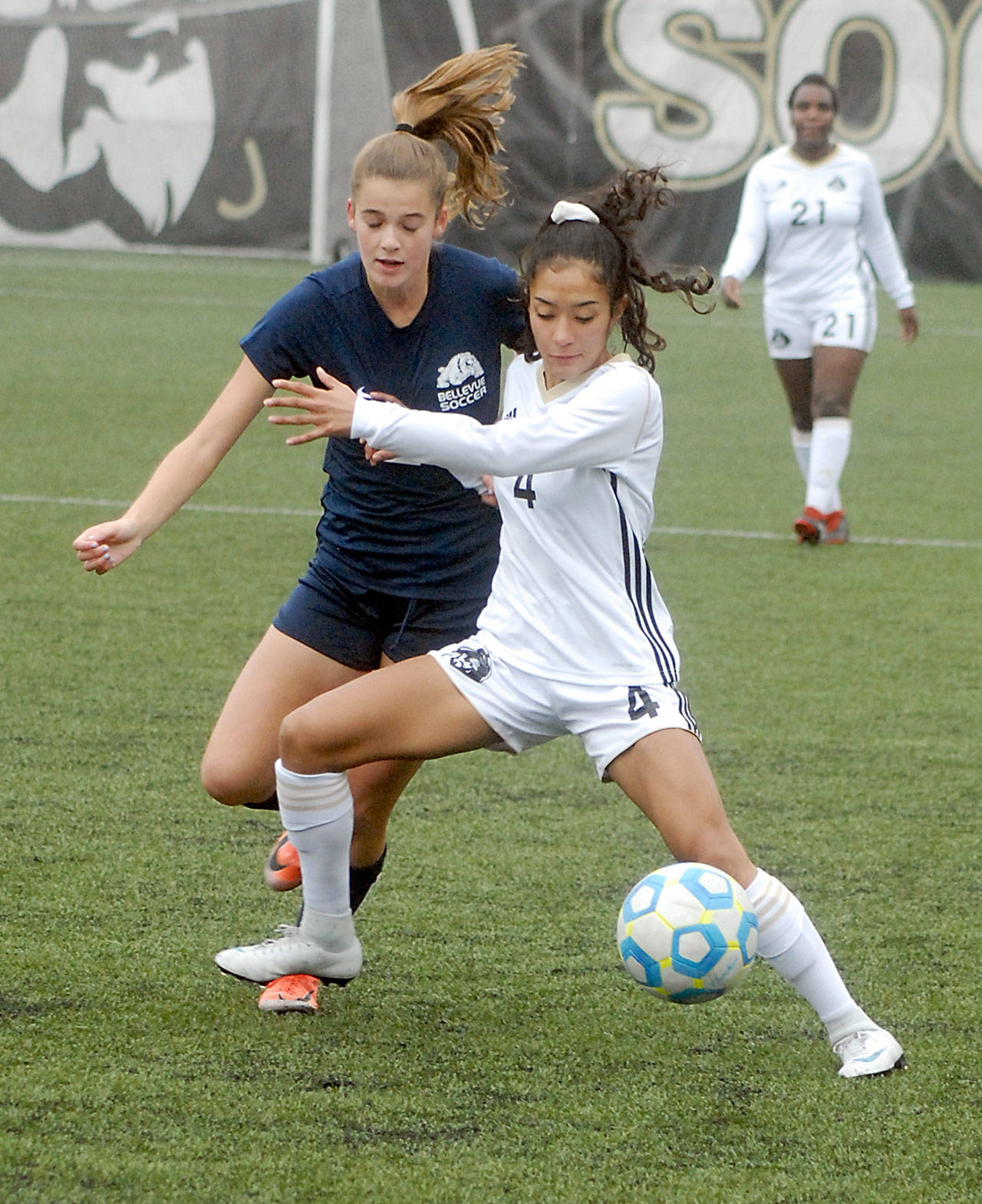 Keith Thorpe/Peninsula Daily News Peninsula’s Zahori Toledo, front, fends off Bellevue’s Teaghen Sweckard during Saturday’s NWAC Quarterfinal playoff match at Wally Sigmar Field in Port Angeles.