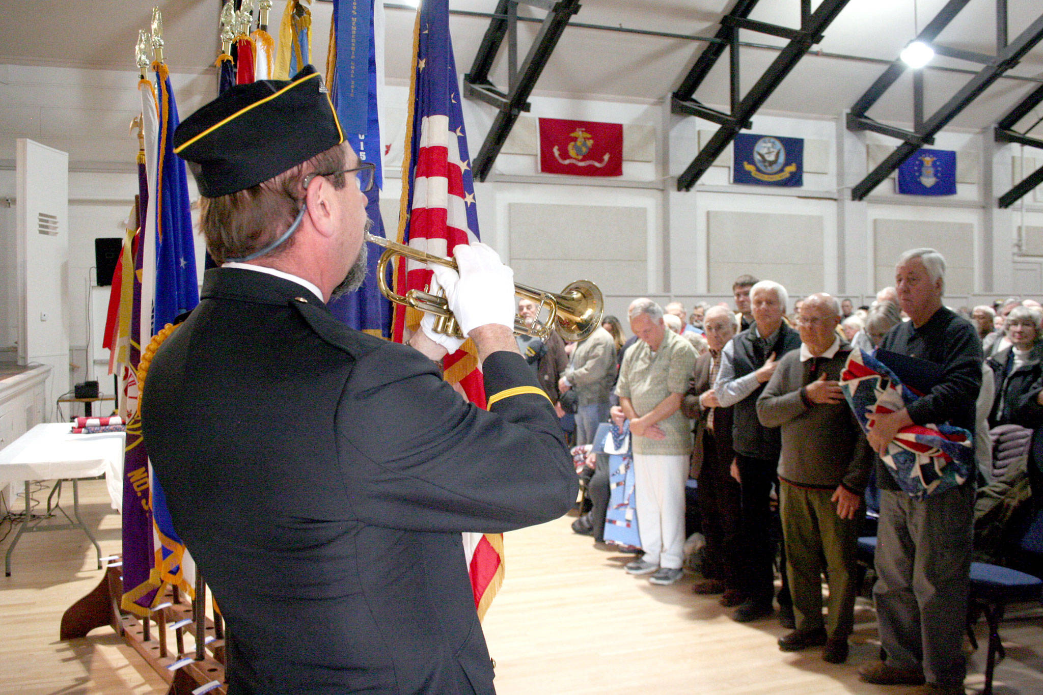 Rick Castellano plays taps a part of the Port Townsend Veterans Day ceremony on Monday at the Marvin G. Shields American Legion Hall. (Brian McLean/Peninsula Daily News)