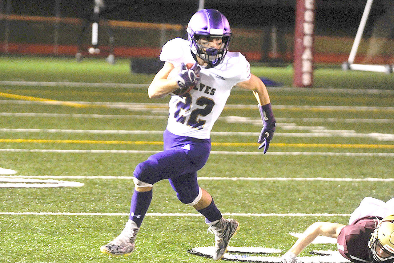 Sequim’s Walker Ward runs against Lakewood on Friday night. (Conor Dowley/Olympic Peninsula News Group)