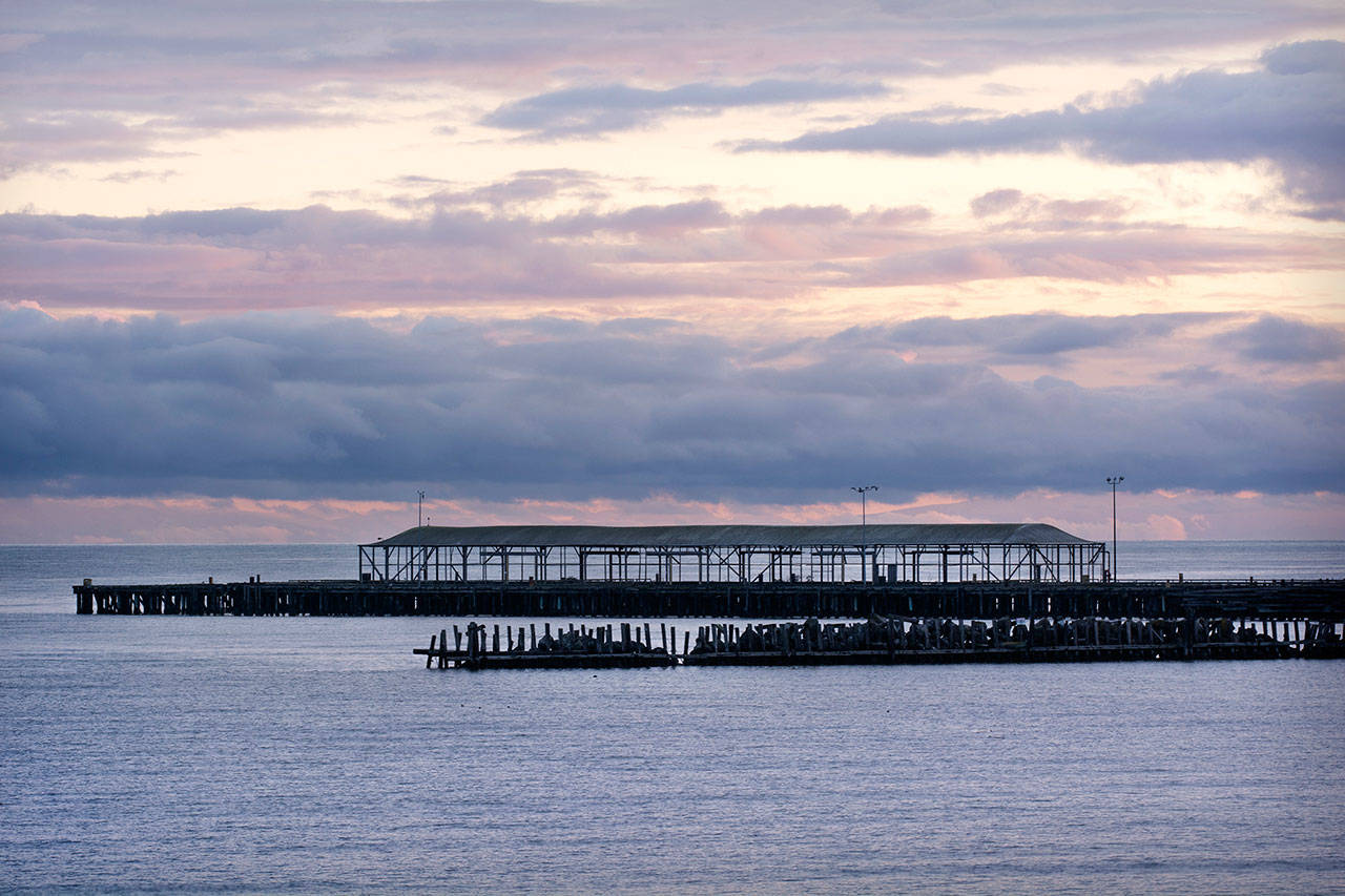 The loading dock and breakwater at the former Rayonier pulp mill, shown Tuesday, are among the few structures still intact at the site east of downtown Port Angeles. (Jesse Major/Peninsula Daily News)