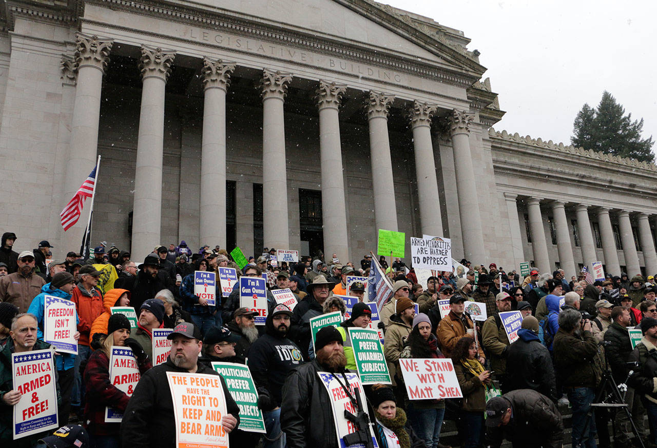 Gun-rights supporters rally on the steps of the Washington Capitol, in Olympia on Jan. 17, 2020. Several Republican lawmakers spoke at the rally decrying gun control measures being considered by the Legislature this year. (AP Photo/Rachel La Corte)