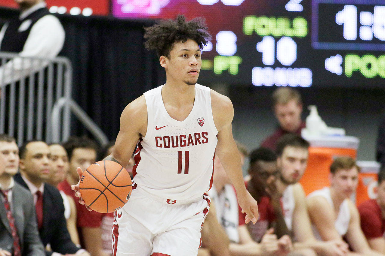 Washington State forward DJ Rodman (11) dribbles during the second half of an NCAA college basketball game against Washington in Pullman on Sunday, Feb. 9, 2020. (Young Kwak/Associated Press file)