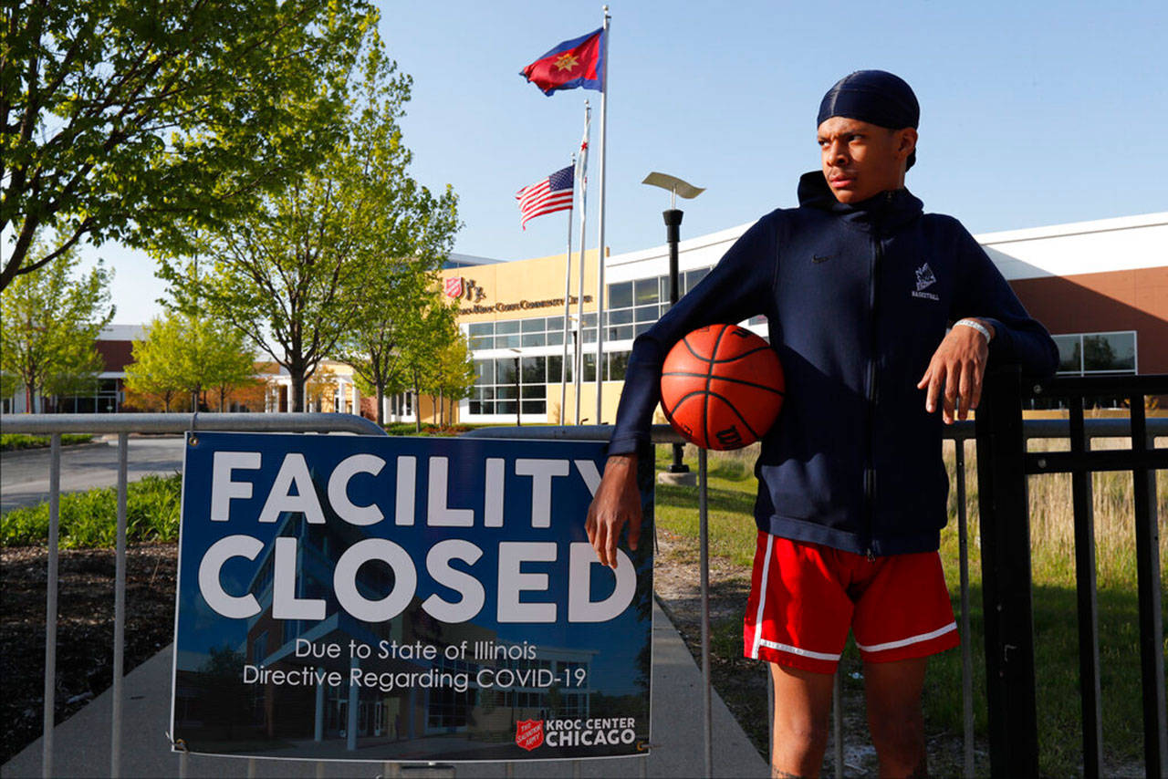 In this Tuesday, May 12, 2020, photo, Saint Wilkins poses for a portrait outside The Salvation Army’s Ray and Joan Kroc Corps Community Center on Chicago’s Southside. Growing up in a rough part of Chicago’s South Side, Wilkins figured he was headed for a life on the streets. “If it wasn’t for the Kroc Center, I’d be gang-banging,” Wilkins said. “I promise you that.” (Charles Rex Arbogast/Associated Press)