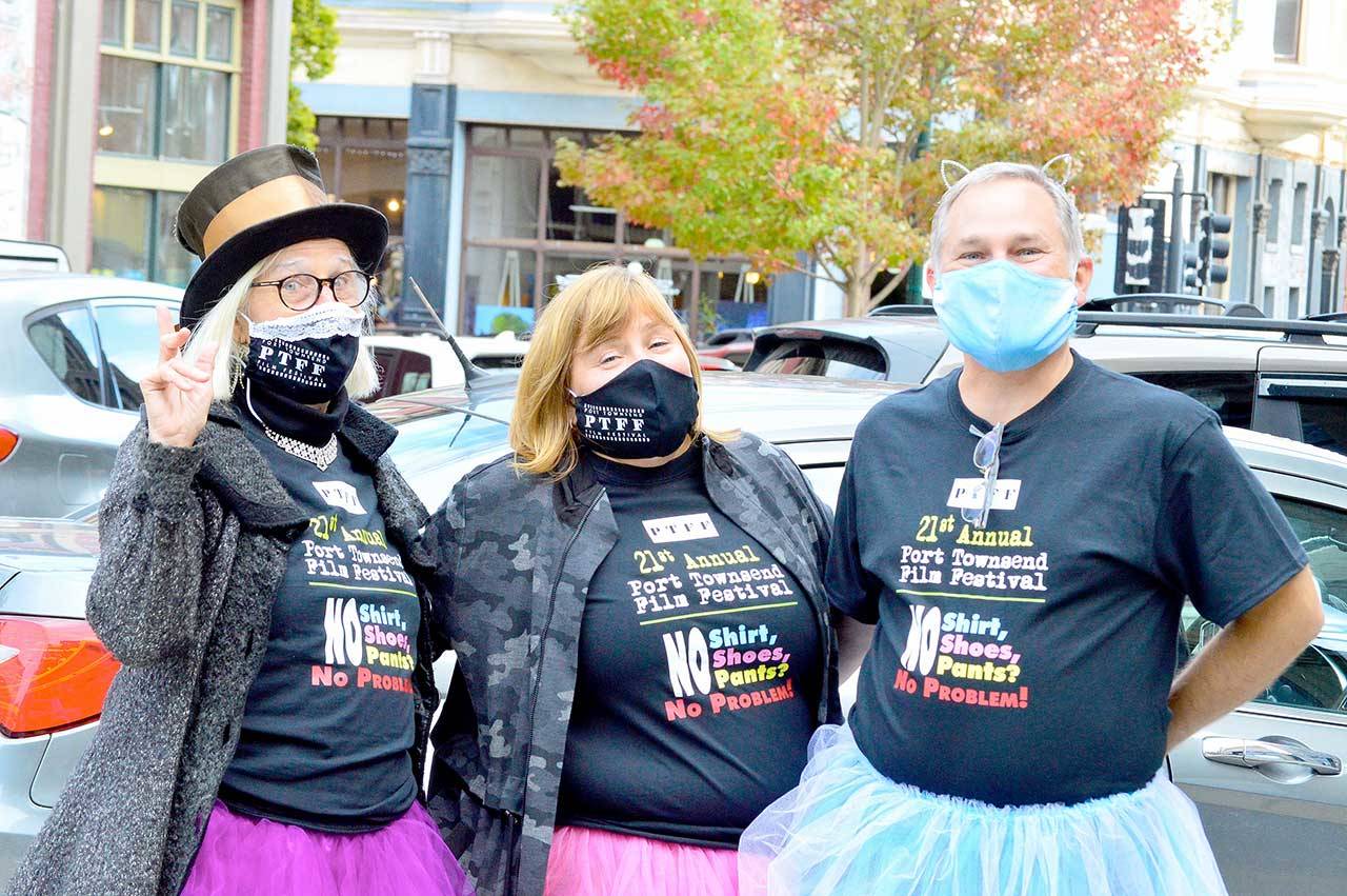 Wearing their tutus, just to add lightness to the proceedings, are, from left, Port Townsend Film Festival Executive Director Janette Force and popcorn sponsors Holley and Todd Carlson. (Diane Urbani de al Paz/for Peninsula Daily News)