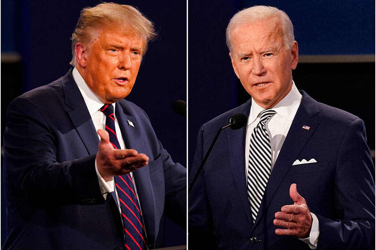 FILE - This combination of Sept. 29, 2020, file photos shows President Donald Trump, left, and former Vice President Joe Biden during the first presidential debate at Case Western University and Cleveland Clinic, in Cleveland, Ohio. (AP Photo/Patrick Semansky, File)