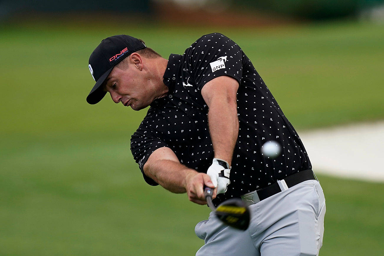 Bryson DeChambeau tees off on the third hole during a practice round for the Masters golf tournament Tuesday, Nov. 10, 2020, in Augusta, Ga. (AP Photo/David J. Phillip)