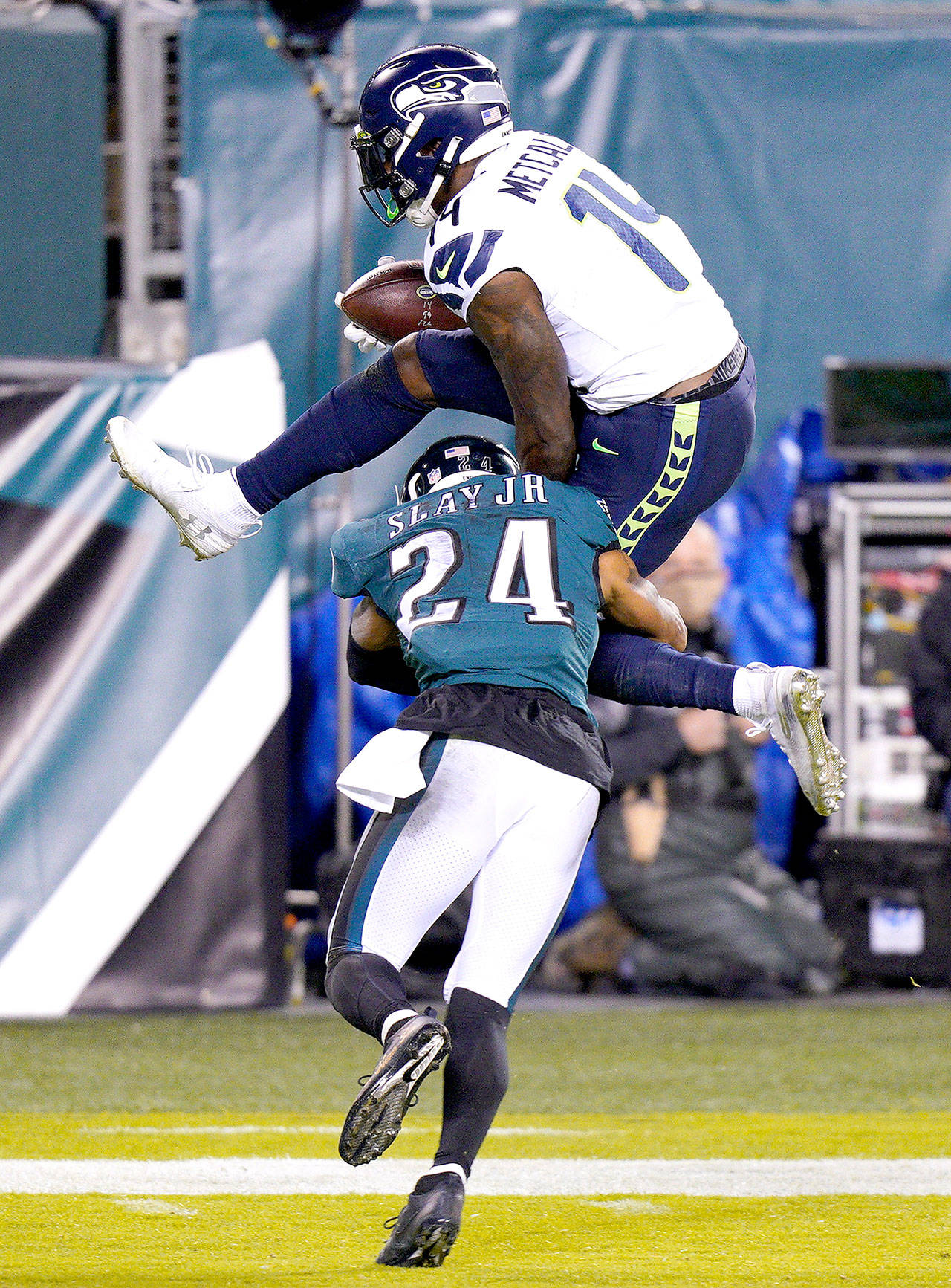Seattle Seahawks’ DK Metcalf (14) tries to get past Philadelphia Eagles’ Darius Slay (24) during the first half of an NFL football game Monday, Nov. 30, 2020, in Philadelphia. (Chris Szagola/Associated Press)