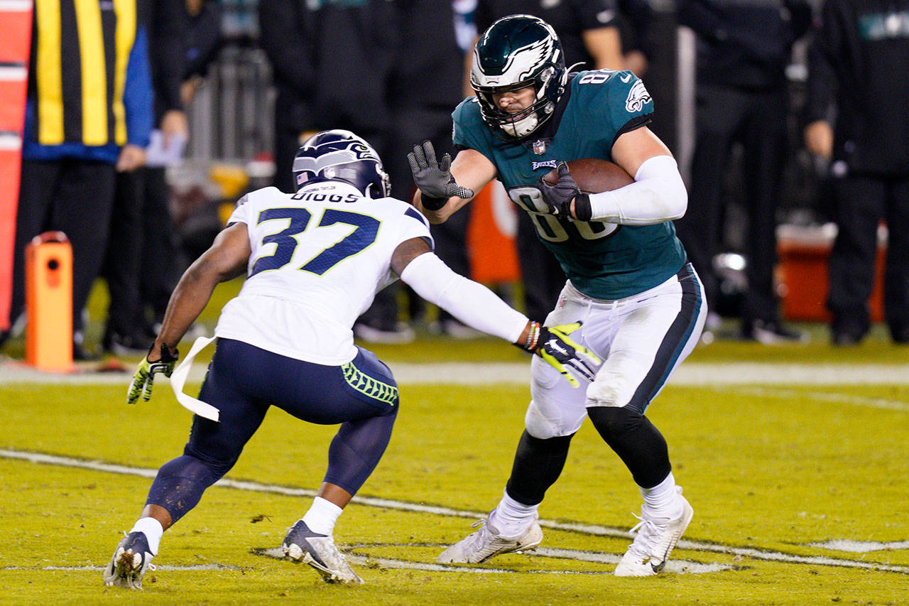 Philadelphia Eagles’ Dallas Goedert (88) tries to get past Seattle Seahawks’ Quandre Diggs (37) during the second half of an NFL football game Monday, Nov. 30, 2020, in Philadelphia. (Chris Szagola/Associated Press)