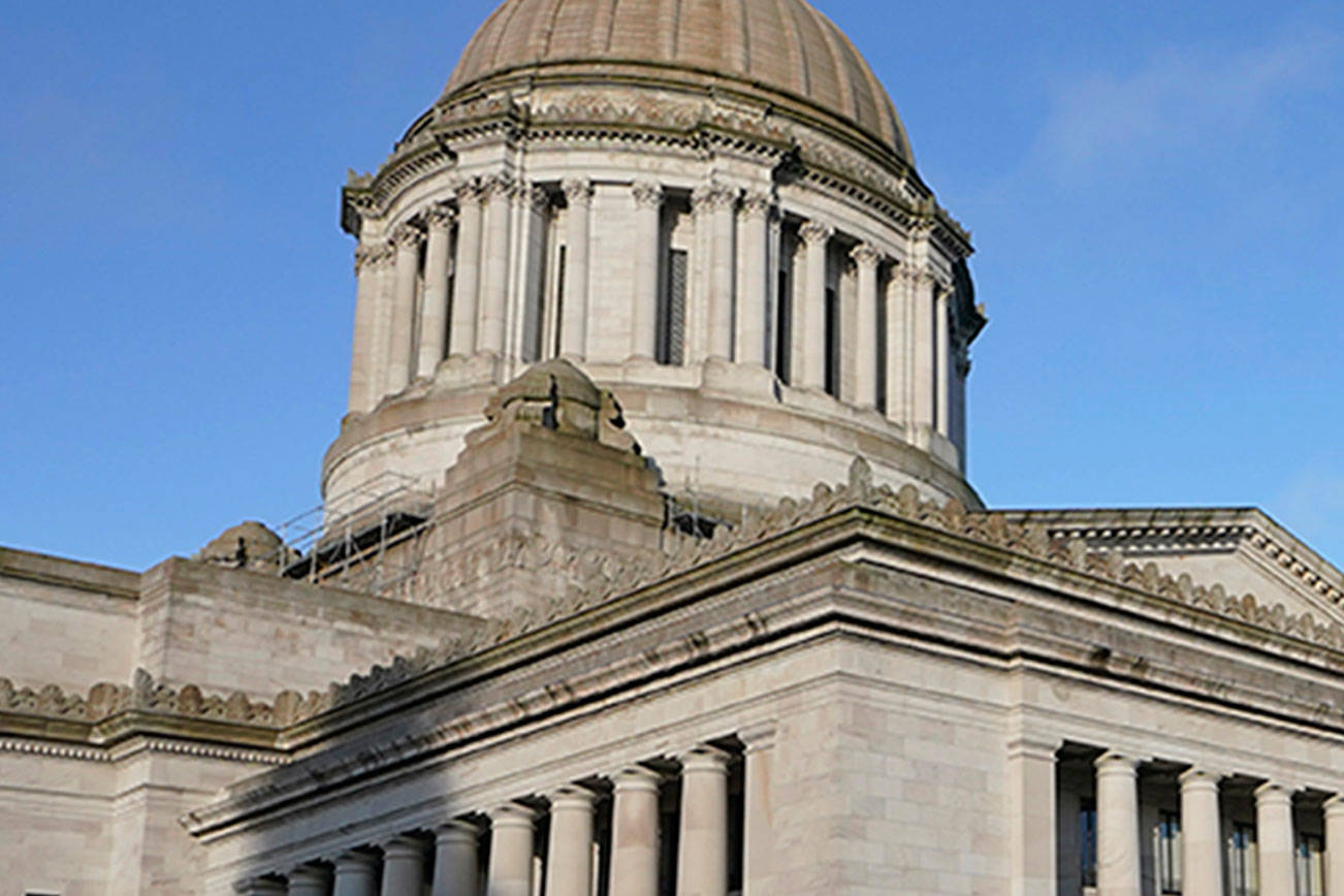 The Capitol in Olympia where members of the National Guard work with the Washington State Patrol to protect the Capitol campus ahead of the state Legislature opening its 2021 legislative session Monday, as several protests and rallies are expected. (Ted S. Warren/The Associated Press)
